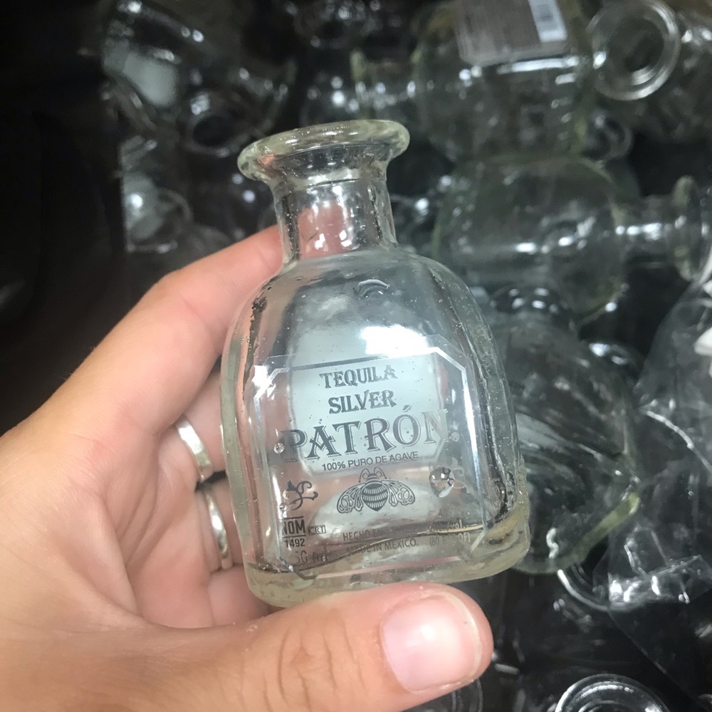 80 Mini patron bottles. No lids comes with black and white striped mini straws